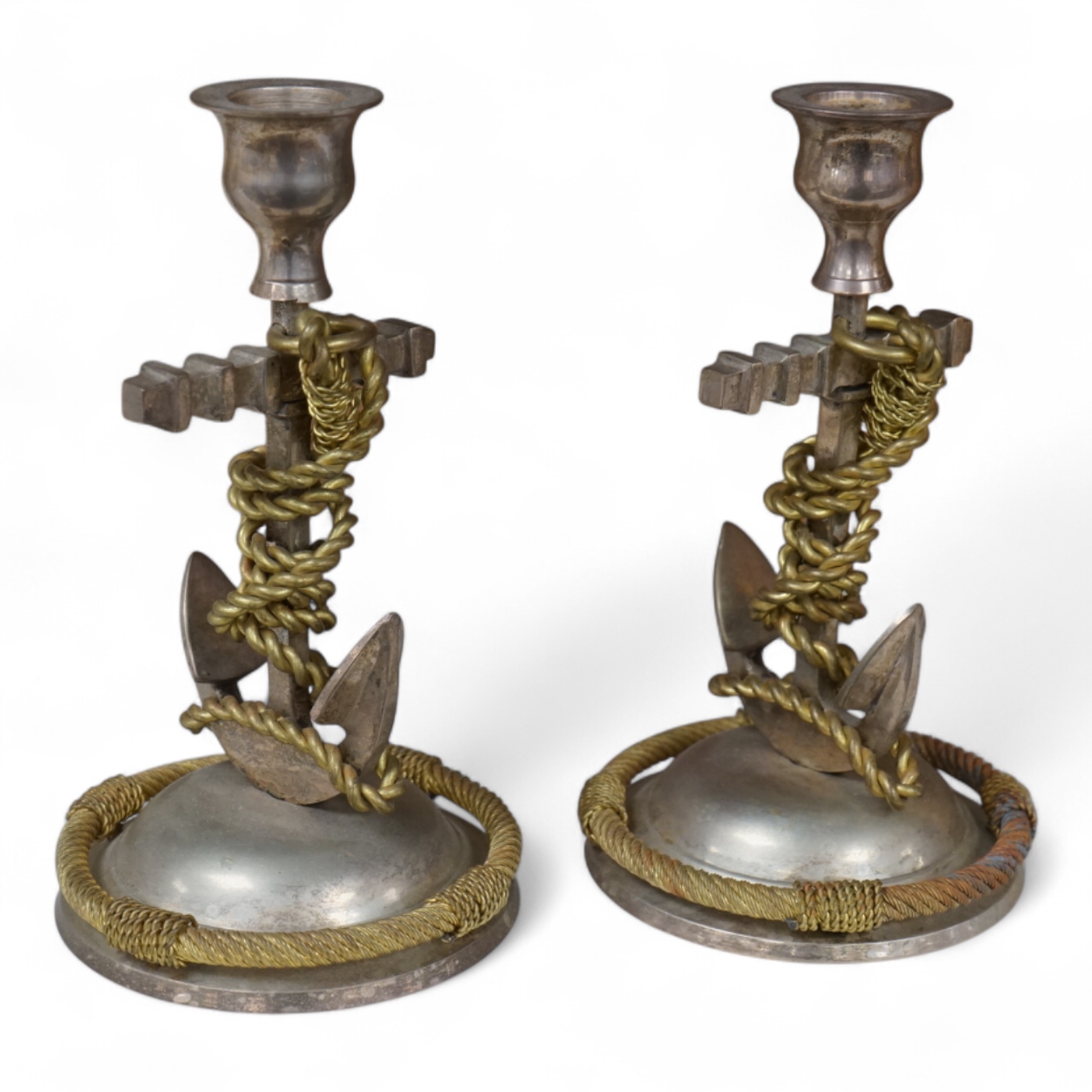 A pair of silver plated and part gilded anchor candlesticks, 18cm high.